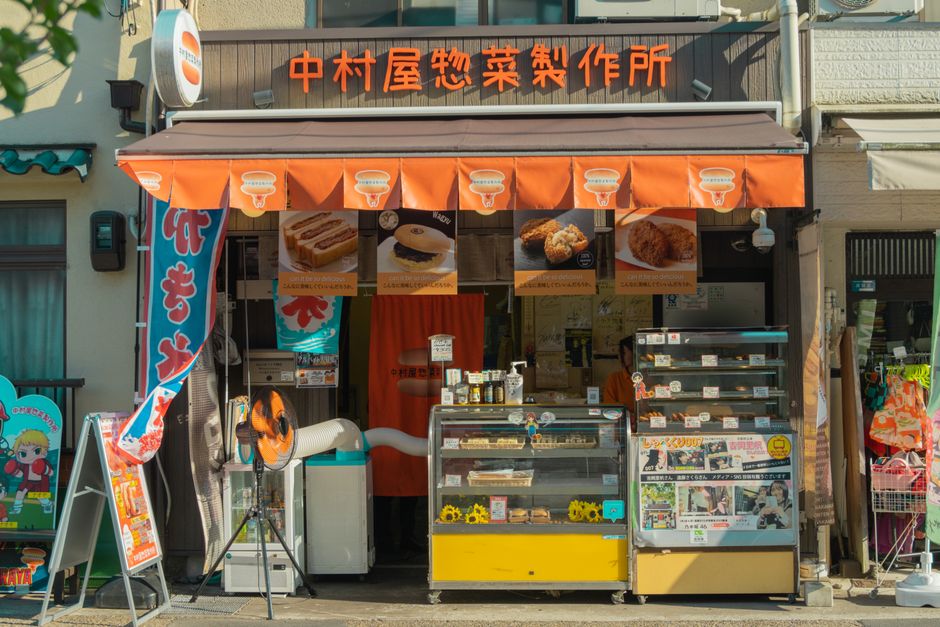 Traditional street food stall in Kyoto, Japan showcasing local delicacies and vibrant urban culture.