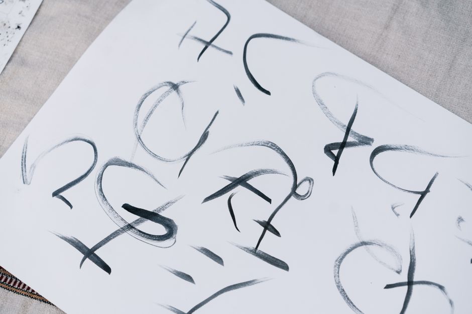 A close-up of elegant Japanese calligraphy inked on white paper, conveying artistic expression.
